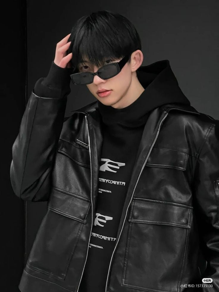 Vintage-style black oversized vegan leather biker jacket.