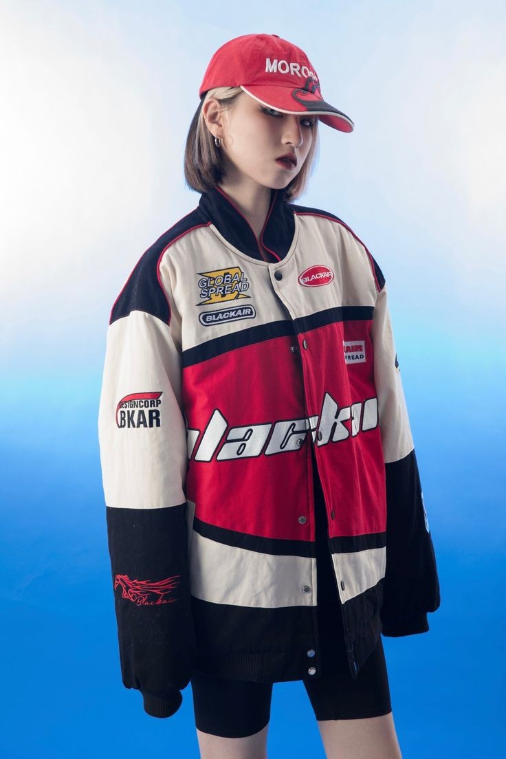 A close-up view of the left sleeve of the vintage Blackair racer jacket, highlighting a vibrant retro logo along with colorful racing stripes that enhance its sporty aesthetic.