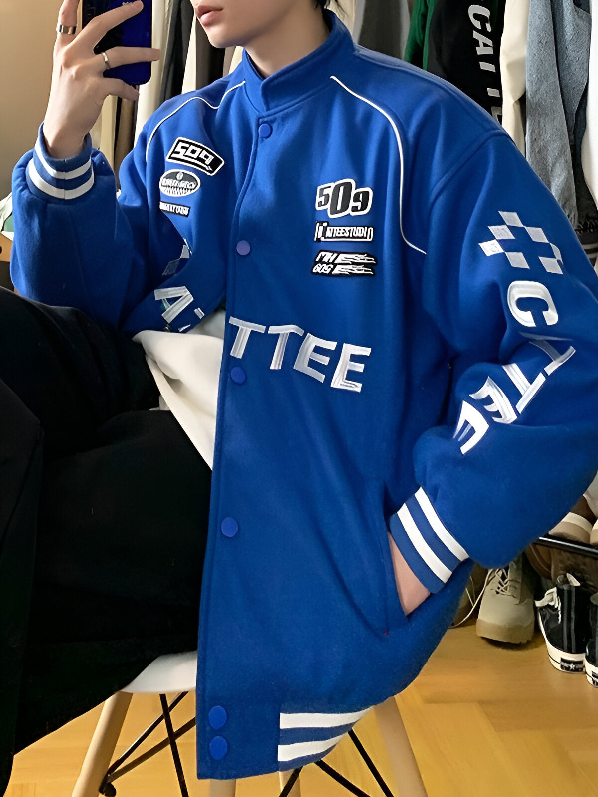 A model wearing the retro racing jacket, styled with casual streetwear for a trendy autumn look.