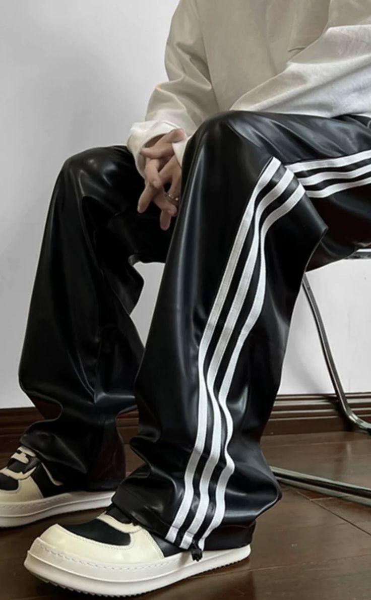 black faux leather track pants with white three-stripe 