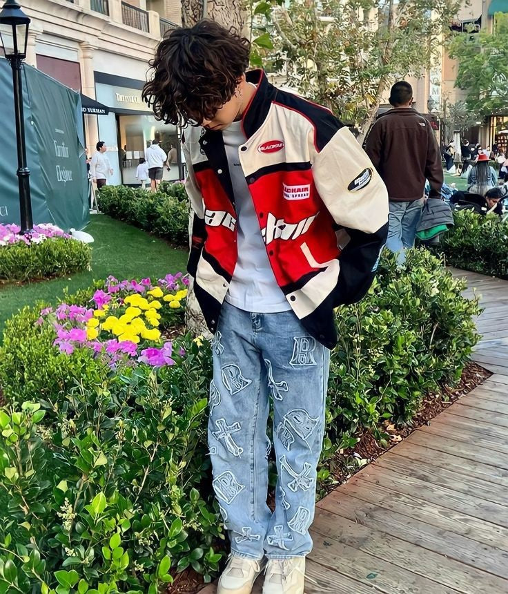 A model wearing the vintage Blackair racer jacket, styled with fitted jeans and sneakers, demonstrating the oversized fit and fashionable appeal in an urban environment.