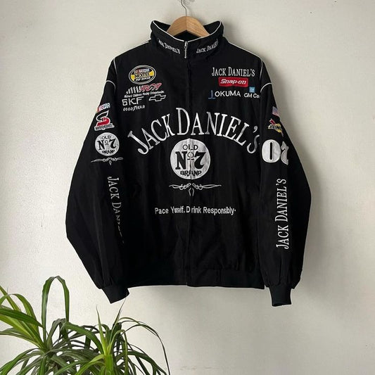 Vintage Jack Daniel's retro racer jacket featuring bold logo patches and classic motorsport-inspired design. The front showcases a zip-up closure with striking black and white contrast, suitable for unisex fashion.
