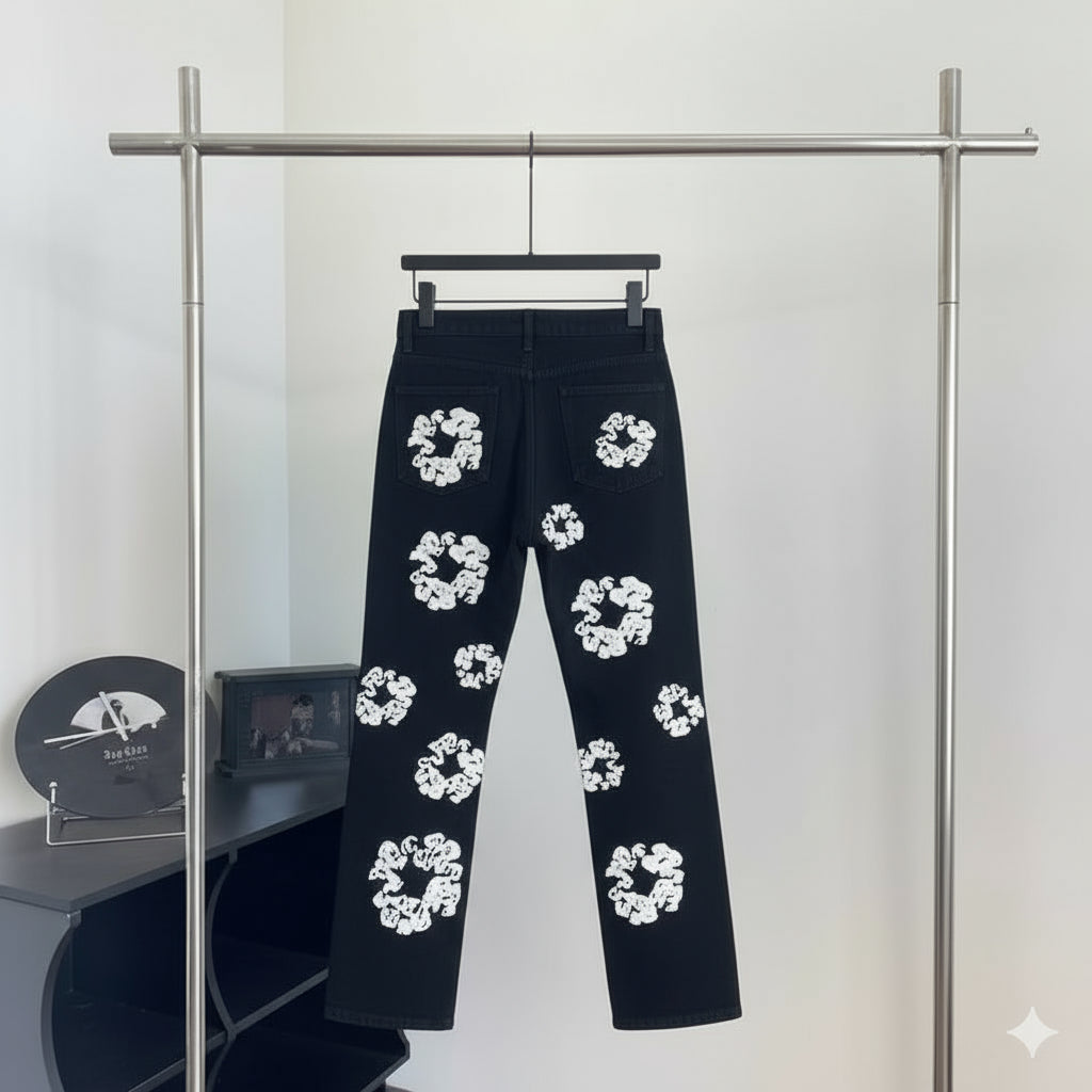 Black denim jeans with white flower print on rack