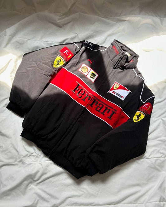 Ferrari racing suit with various logos on a white background