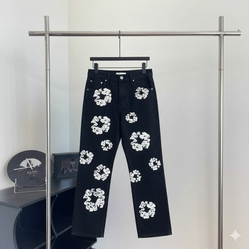 Black denim jeans with white flower print on rack