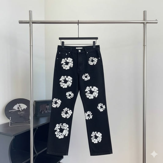 Black denim jeans with white flower print on rack