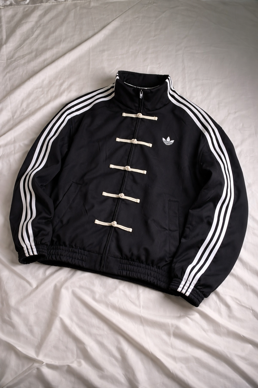 Black CNY jacket with white stripes on a light gray background
