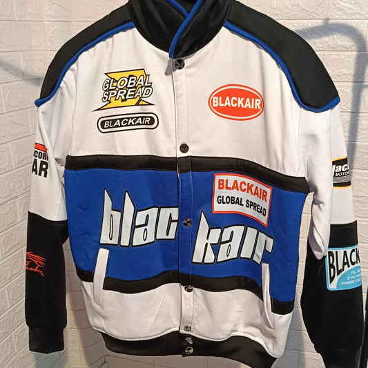 BlackAir printed bike racer jacket in black, featuring a stylish design with bold, white text and graphics across the front, back, and sleeves. The jacket has a stand-up collar, zip closure, and multiple patches with racing-inspired motifs. It has a sleek, fitted silhouette, giving it a modern, streetwear vibe.