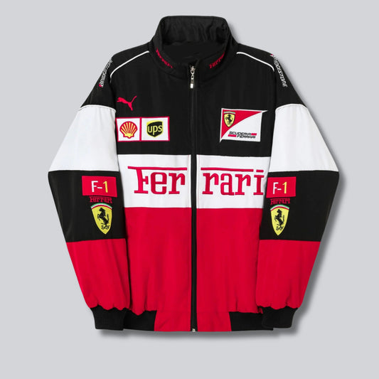 Ferrari F1 vintage racing jacket in vibrant red, featuring iconic Ferrari logos and racing patches on the front, back, and sleeves. The jacket has a zip-up front, stand-up collar, and a sporty, retro design with contrasting black and white accents. It offers a fitted silhouette, evoking classic motorsport style.