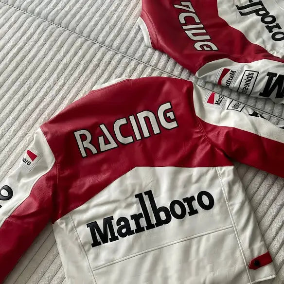 Red and white racing jacket with Marlboro branding on a textured surface