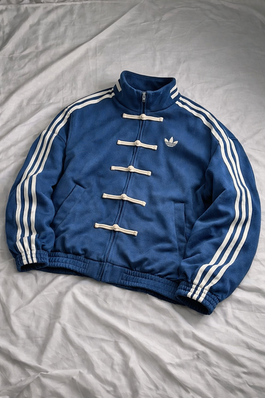 Blue CNY jacket with white stripes on a light gray background